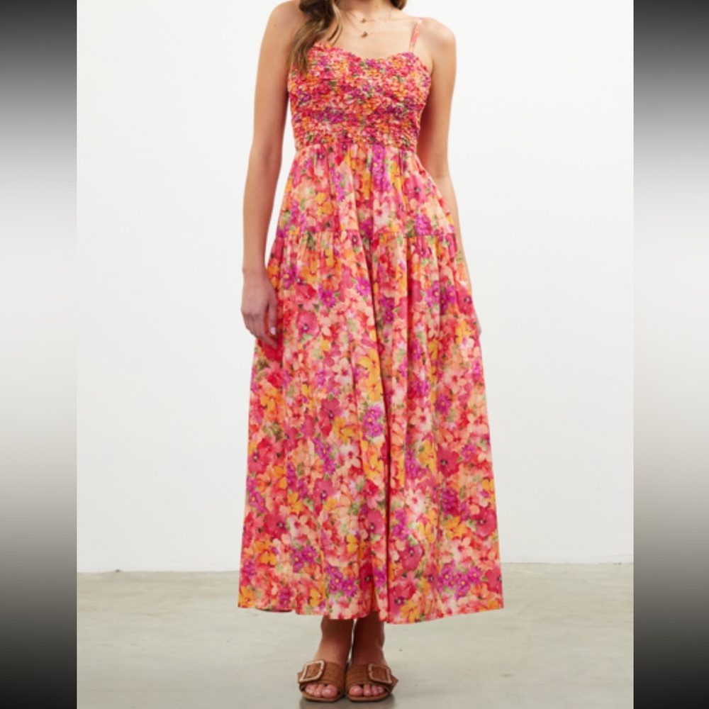 New with tags. Floral maxi dress spaghetti straps. Skies are Blue.